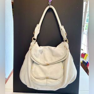 White leather bag.